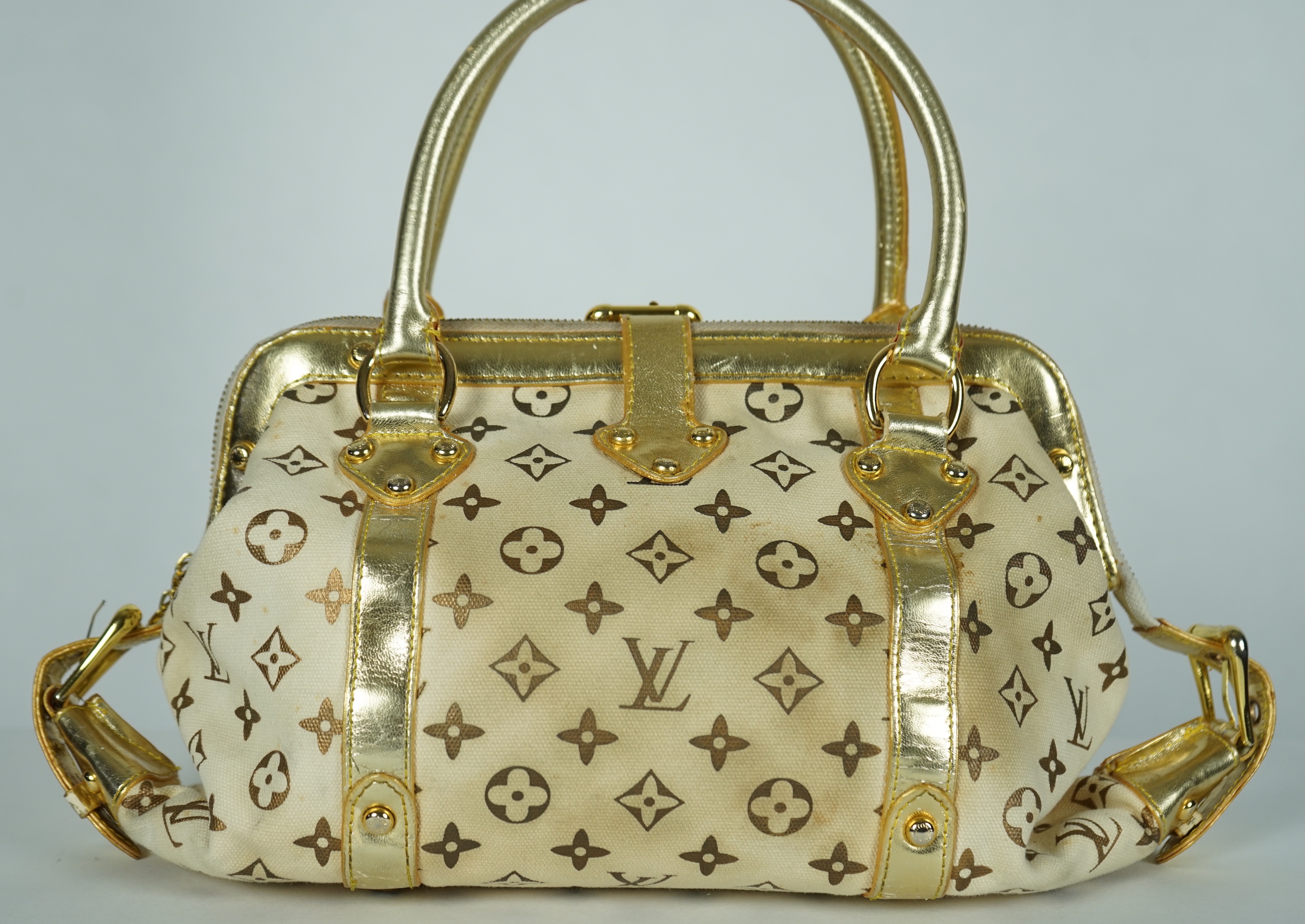 A vintage Louis Vuitton Theda beige and brown Monogram bag